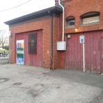 Before: The side wall of the senior center.